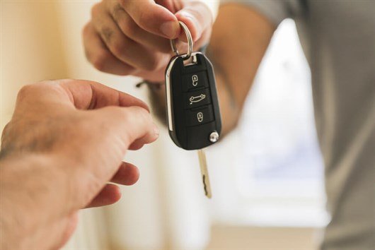 Car Keys Being Handed Over