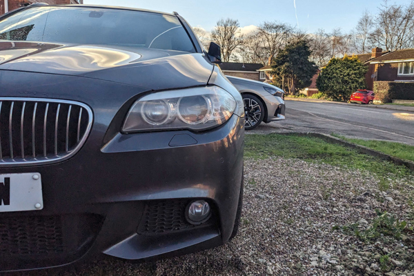 BMW 5 Series F11 generation with current 5 Series in background